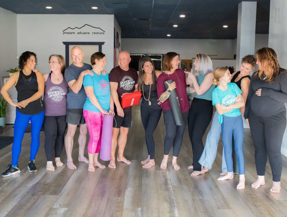 A group of people from the community smiling in a fitness class.