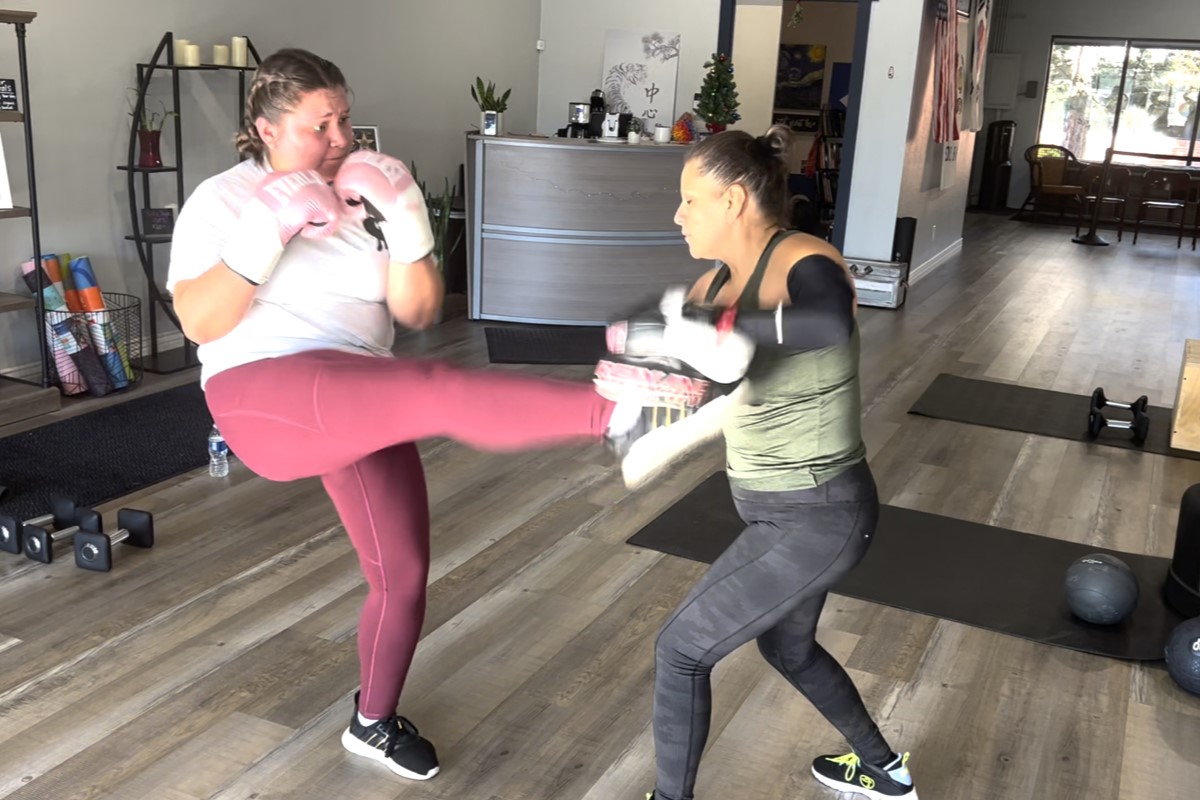 Women kickboxing.