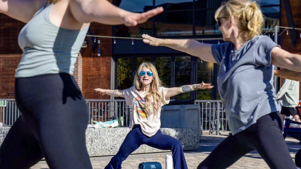 People moving together during an outdoor RMSC class